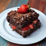 A Chocolate Cake With Strawberry on a Ceramic Plate