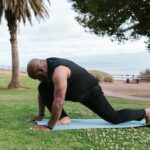 An Elderly Man Doing Yoga at the Park