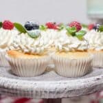 Cupcakes with cream and berries with mint