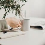 Person Holding White Ceramic Mug