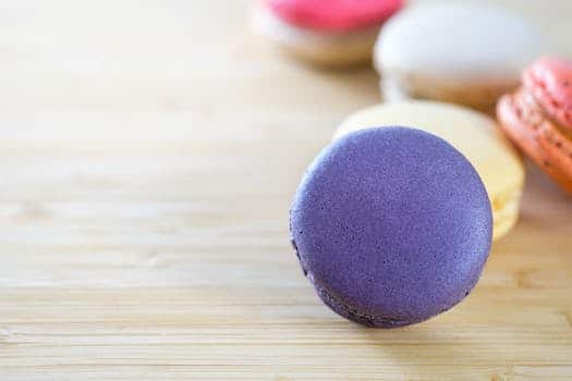 Photo of Macarons on Brown Wooden Surface