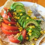 Sliced Tomato and Avocado on White Plate