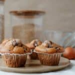 Yummy homemade muffins near ingredients on table