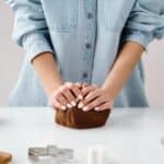 Person Kneading a Chocolate Dough by Hands