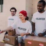 Three People Donating Goods