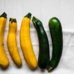 Yellow and Green Vegetable on White Wooden Table