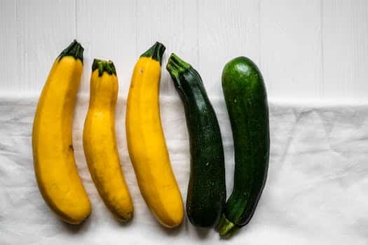 Yellow and Green Vegetable on White Wooden Table