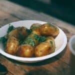 Delicious baked potatoes with greenery