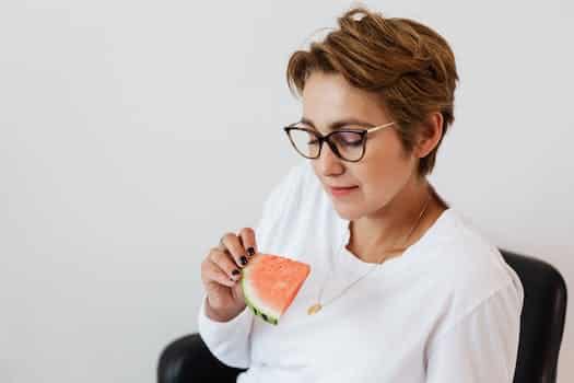 Optimistic female with piece of ripe watermelon