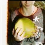 Unrecognizable person with ripe Citrus maxima fruit in hands