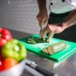 A Person Slicing a Cucumber