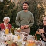 Happy family sitting at table in terrace