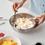 Person Holding Stainless Steel Bowl With Marshmallows