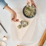 Person Making a Christmas Tree Shaped Bread With Fillings