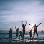 Silhouette Of People By The Seashore