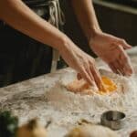 Woman making pastry in bakery