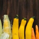 Yellow and Green Corn on Brown Wooden Table