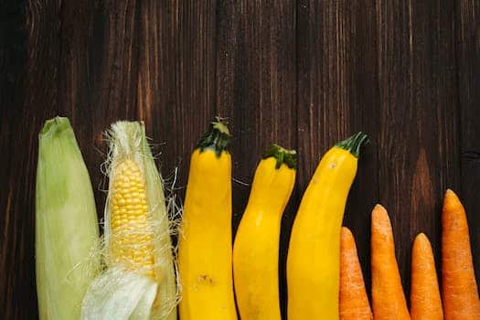 Yellow and Green Corn on Brown Wooden Table